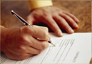 Signing a Mortgage Document